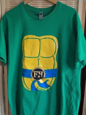 Gildan Green Tee with Yellow Muscle Graphic & Blue Belt Detail